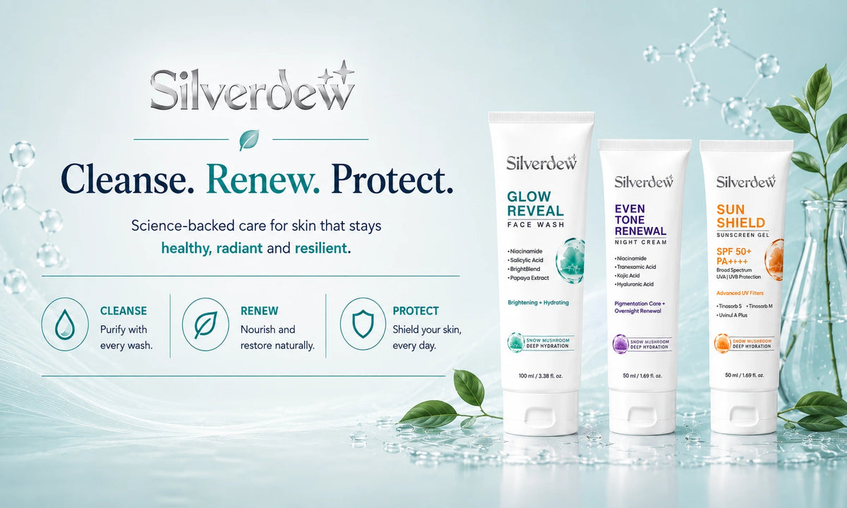 Silver Belt skincare set featuring three white tubes of 'Glow Reveal', 'Even Tint', and 'Sun Block' sunscreen on a light blue background with water droplets and leaves.